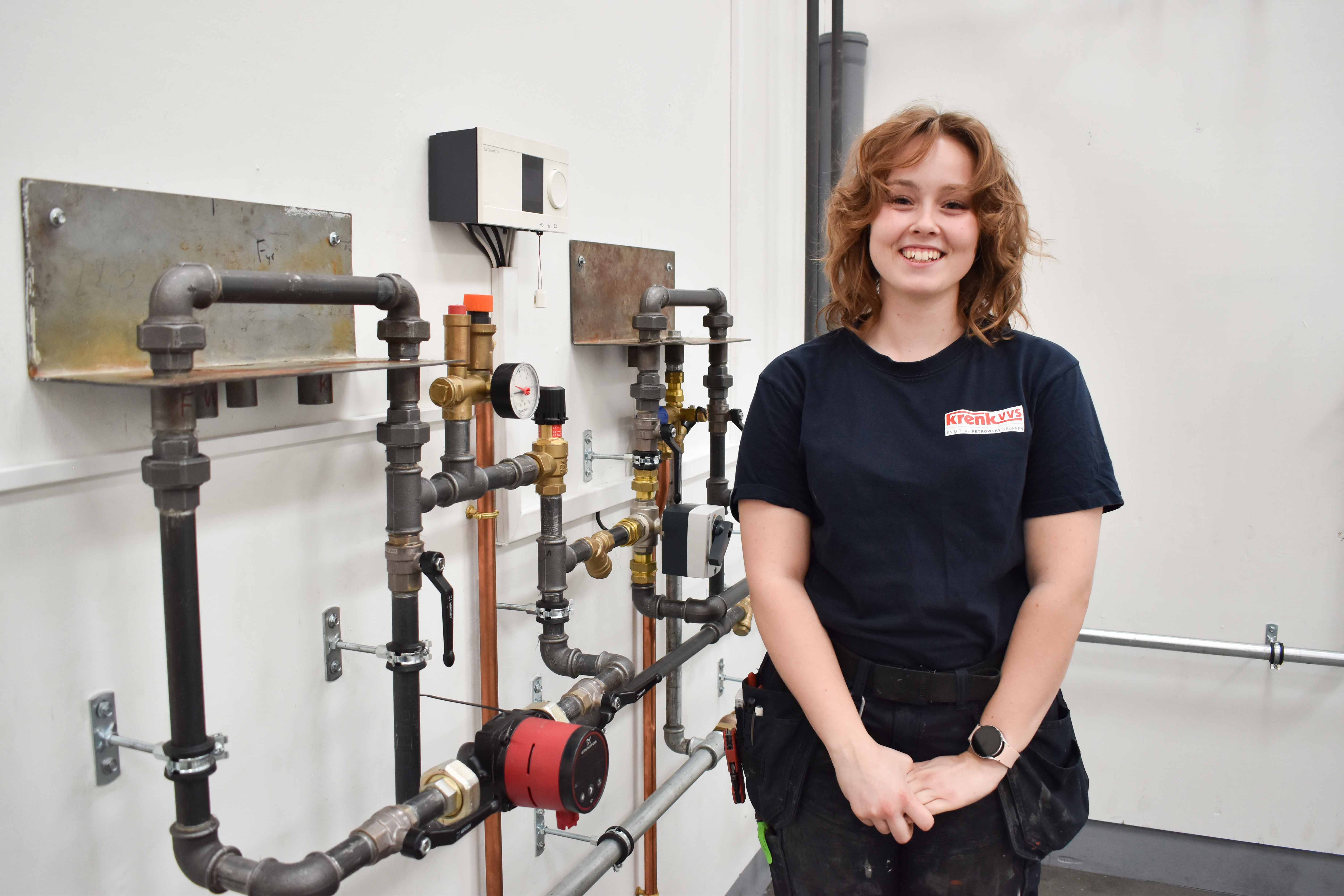 VVS-energispecialist Thea Qvist foran foran sit svendestykke til tre 12-taller.